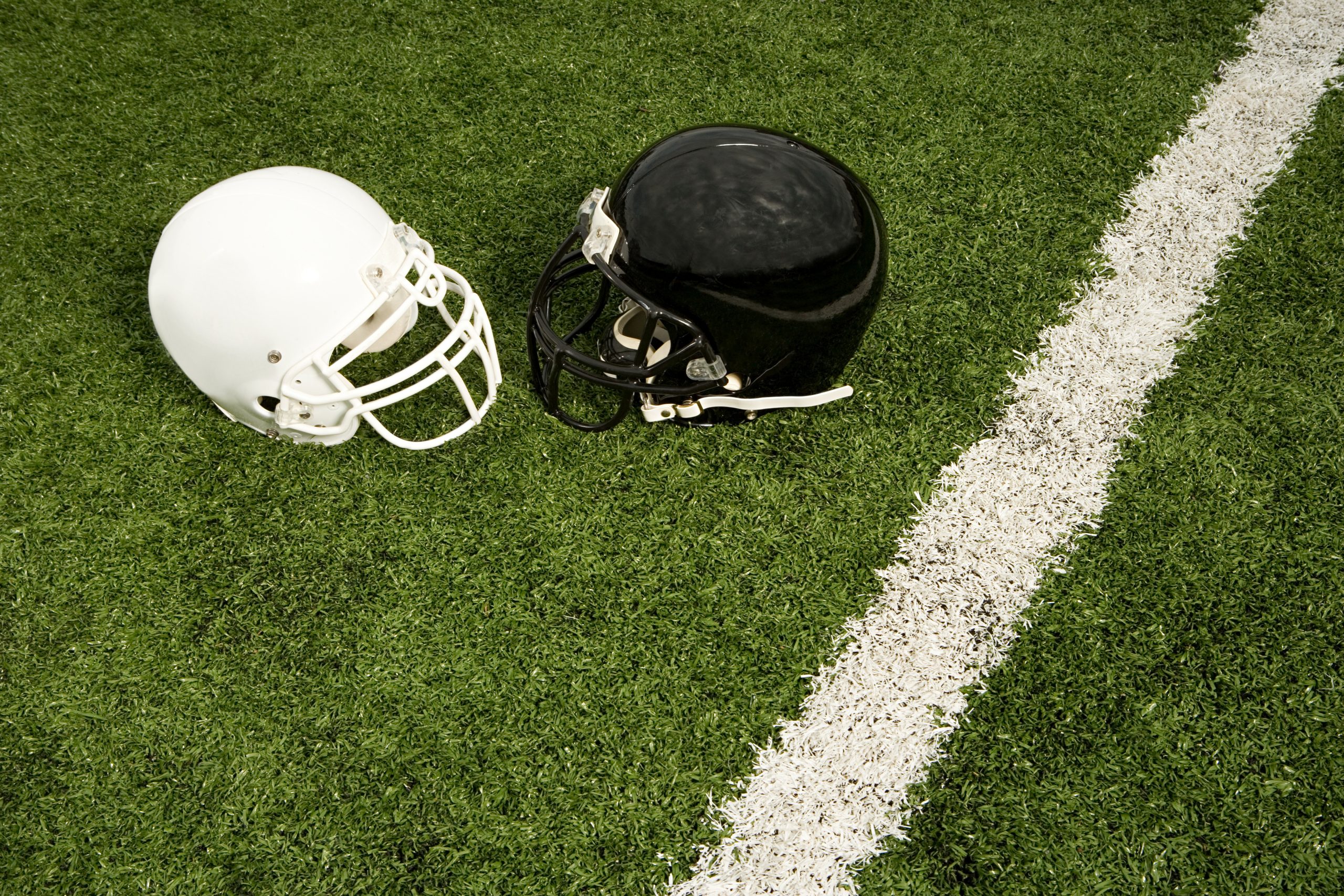 Black and white football helmets