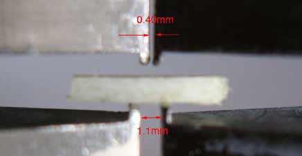 Figure 4. Close-up of specimen in custom 4-point bend fixture.