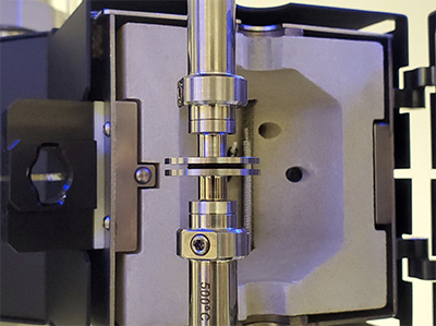 Figure 2. Picture of compression plate geometry and dressing sample on a DMA 3200