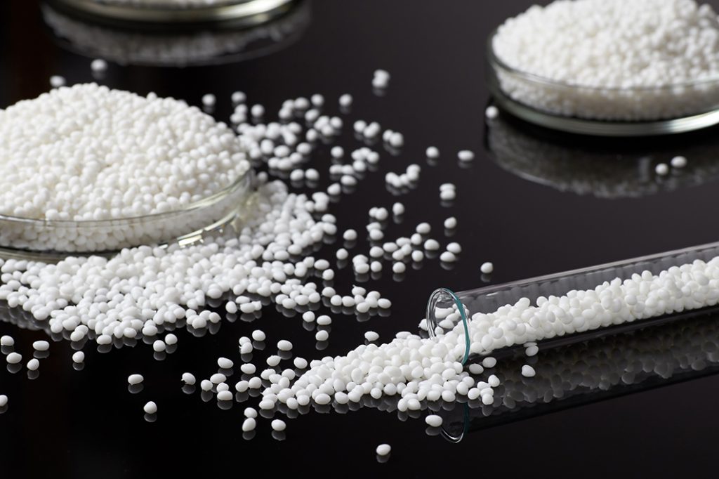Closeup of a granule of white plastic polymer